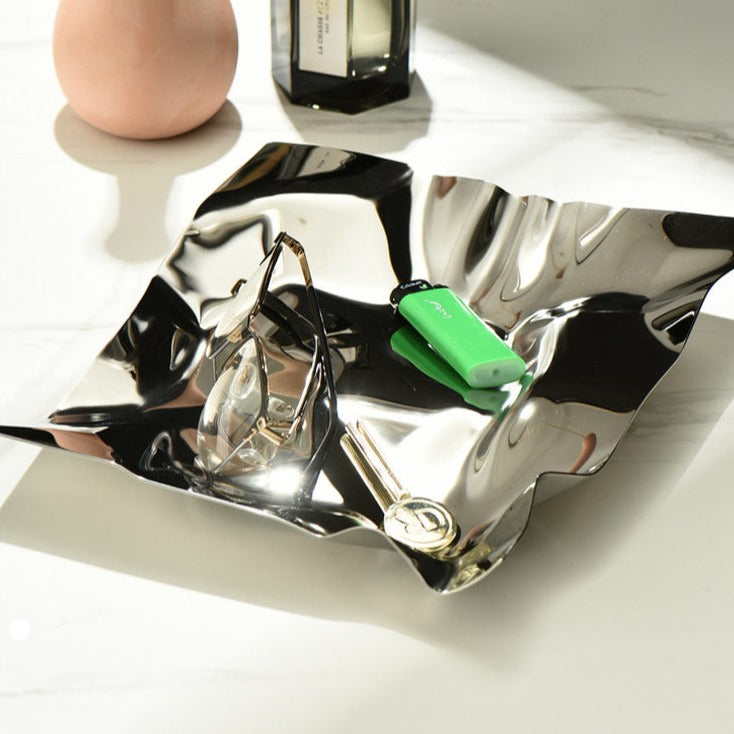 Additional view of the crumpled mirror stainless steel tray.