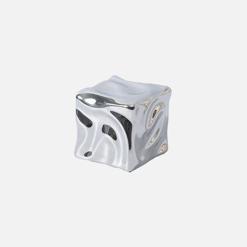 Additional view of the draped ceramic cube ornament.