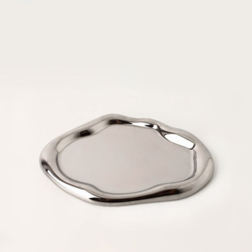 Additional view of the irregular ceramic catchall dish.