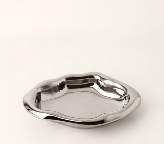 Additional view of the irregular ceramic catchall dish.