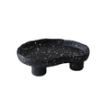 Additional view of the speckled footed resin catchall tray.